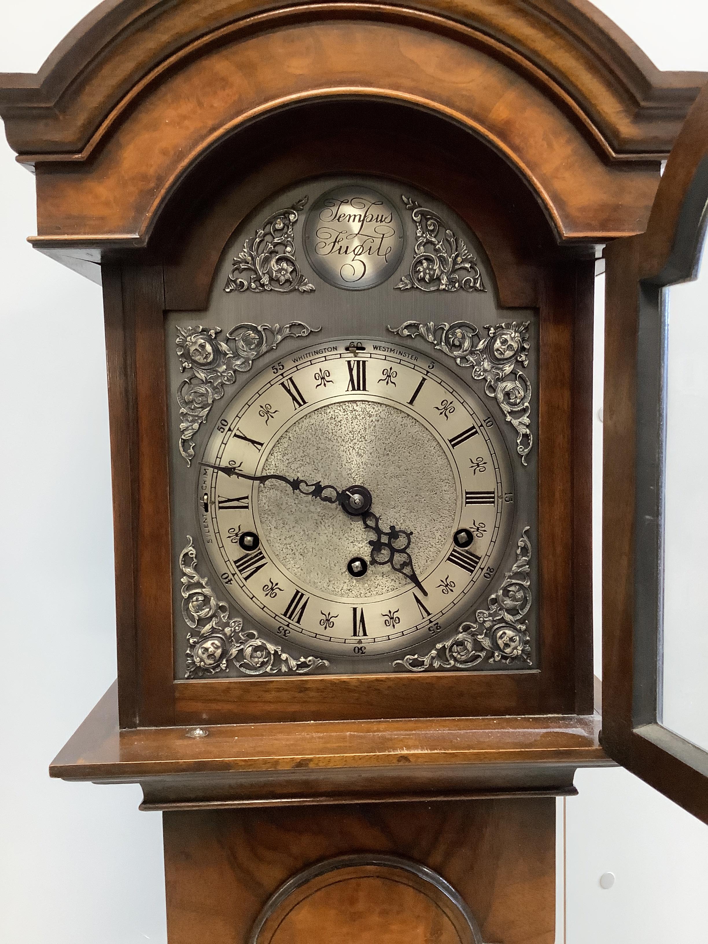 A reproduction 18th century style walnut grandmother clock with Whittington and Westminster chimes, height 153cm